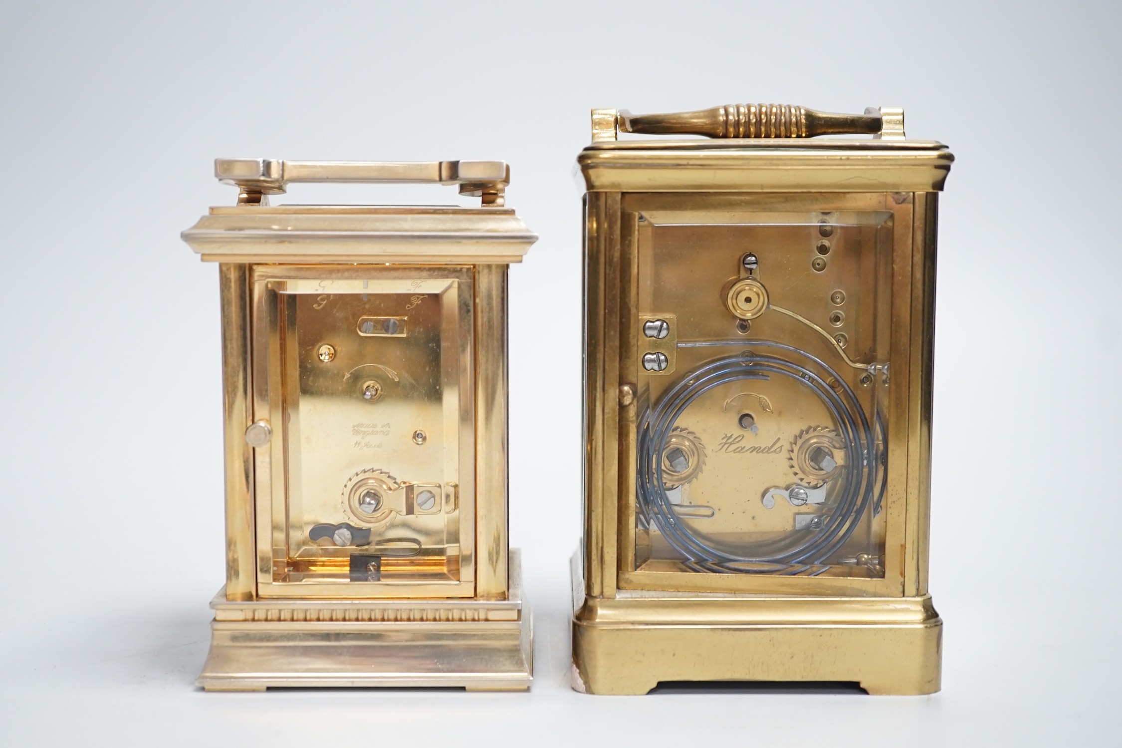 Two English brass carriage clocks with winding keys. Tallest 14.5cm